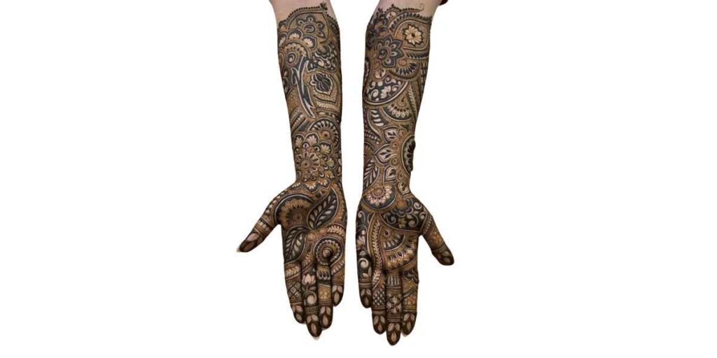 Elegant Full-Hand Mehndi Design with Bold Paisley and Floral Patterns